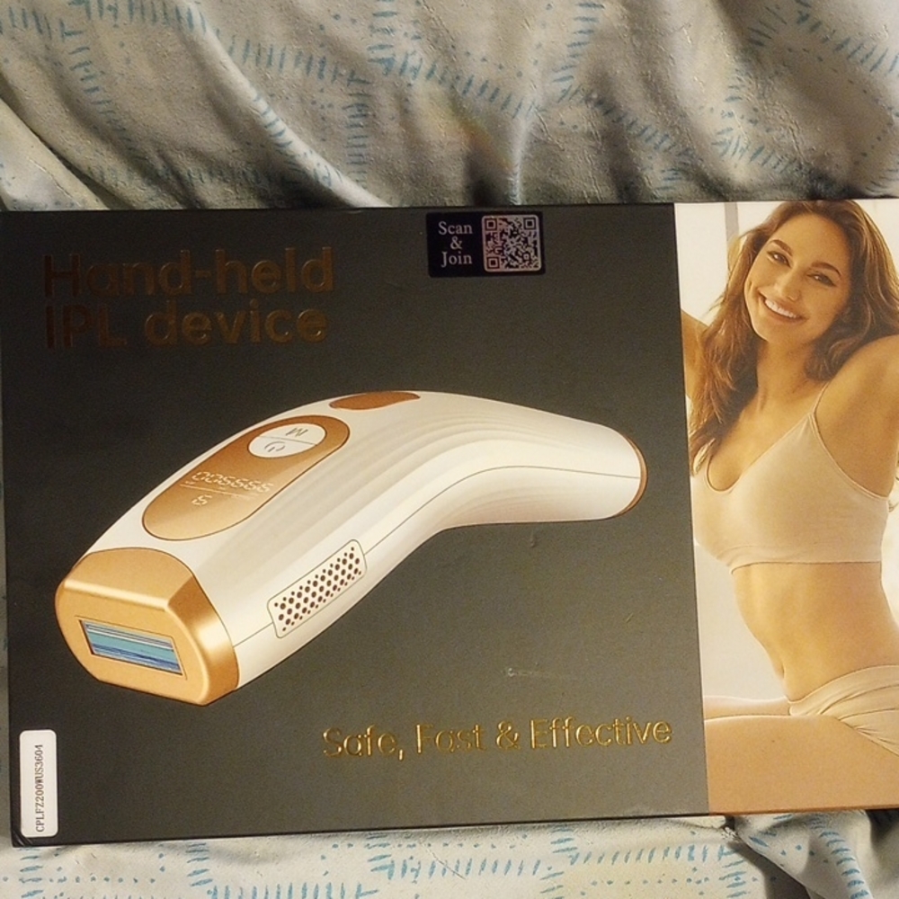 Gold and White Hand-held IPL Device